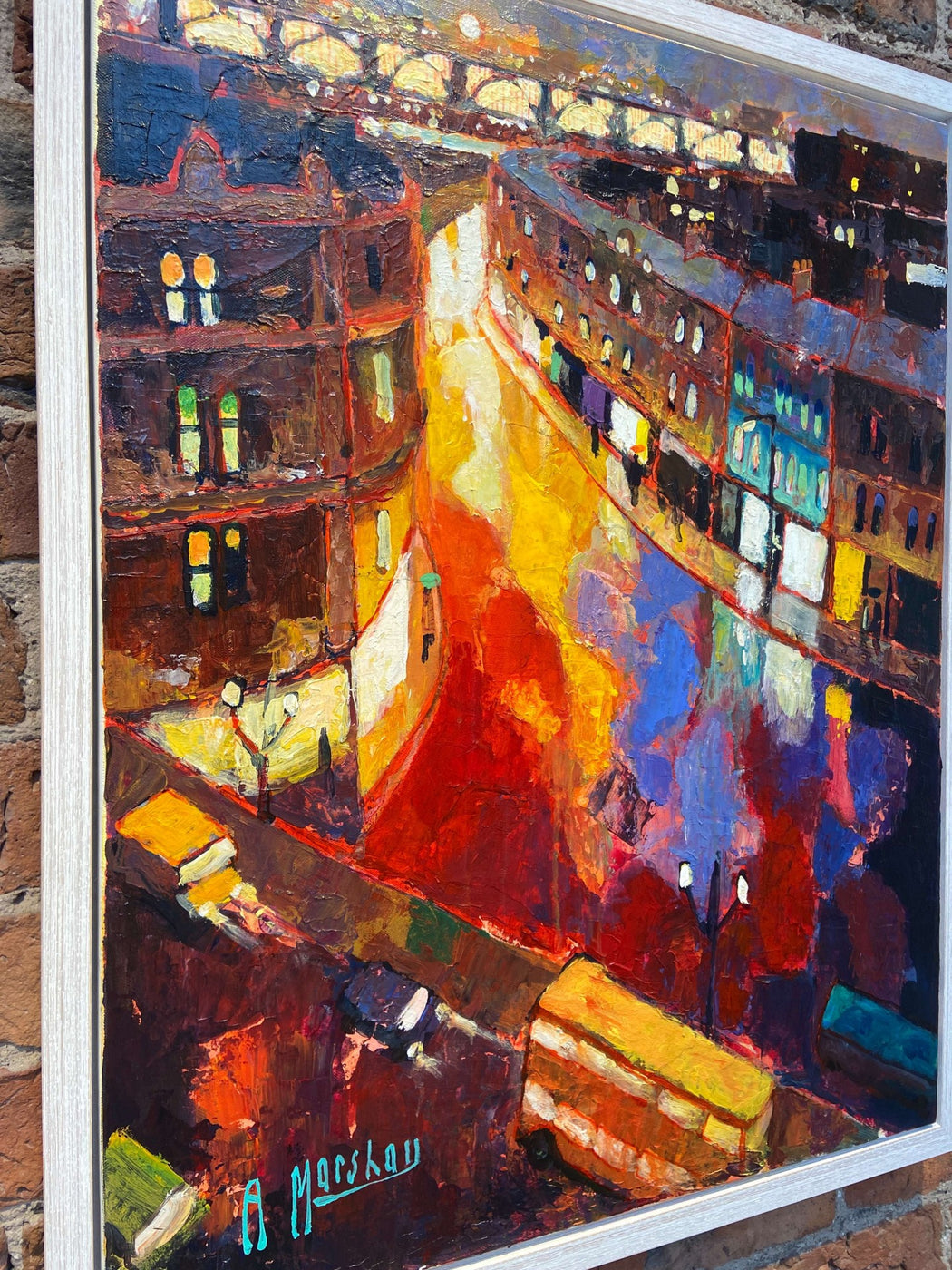 Side Sunrise by Anthony Marshall, a colourful expressive painting of a city scene in a white frame